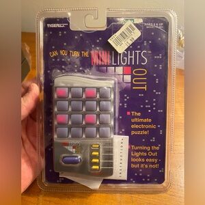 Tiger Electronics Mini Lights Out handheld puzzle game